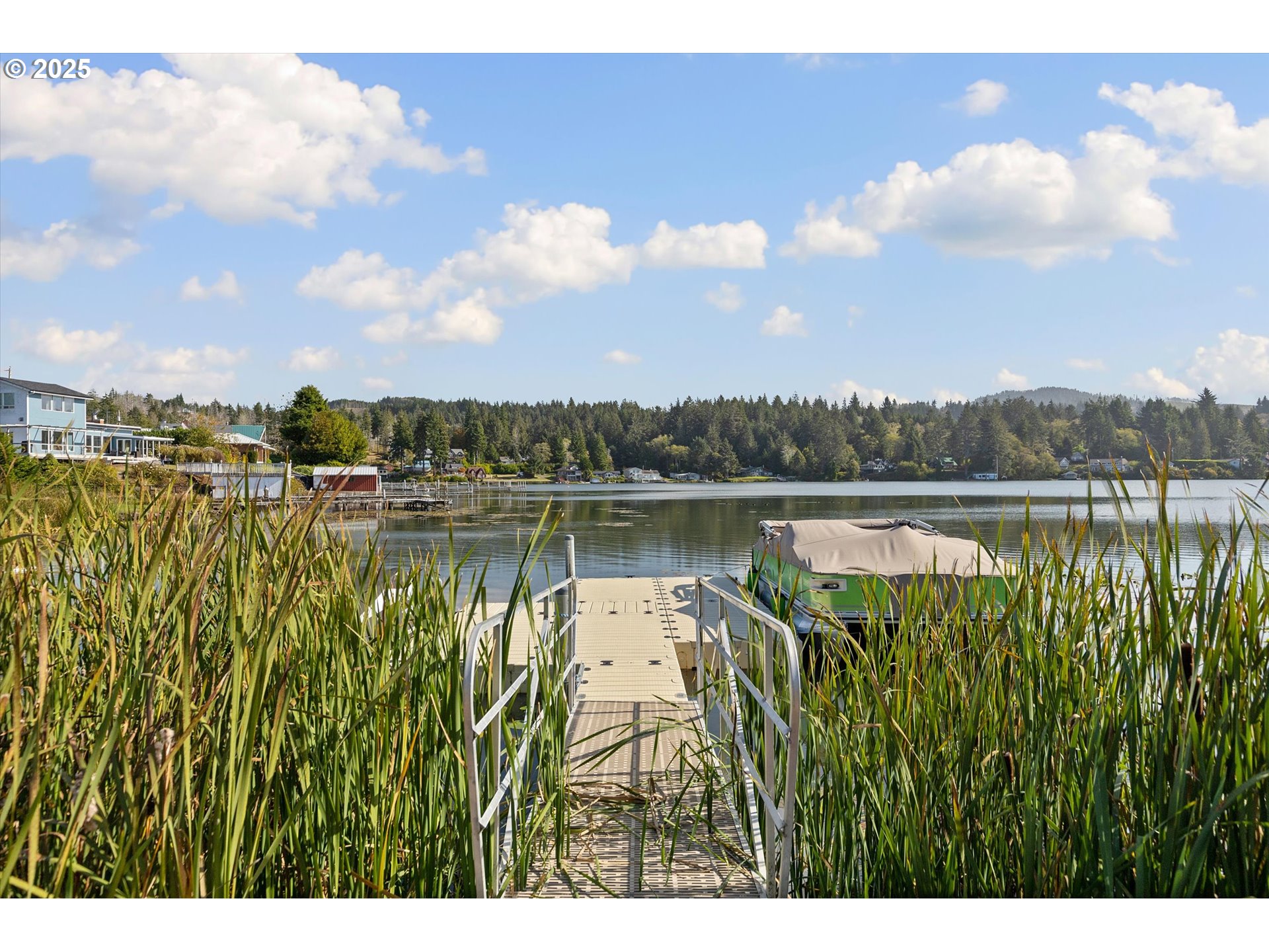 4692 Northeast I Avenue Neotsu, OR 97364 - Photo 4 of 41 a view of a lake with houses in the back