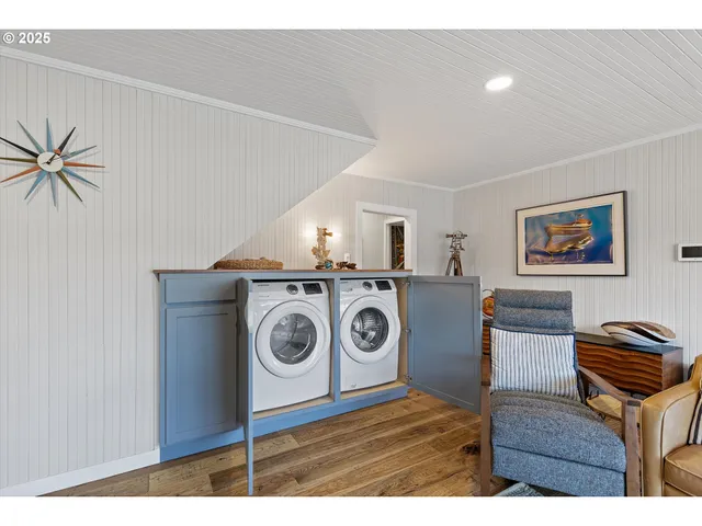a view of kitchen with sink and wooden floor