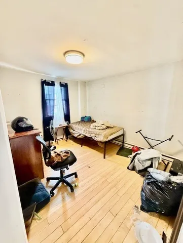 a living room with furniture and a mirror