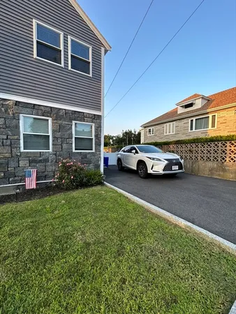a car parked in front of a house