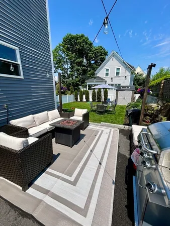 a view of a patio with couches and potted plants