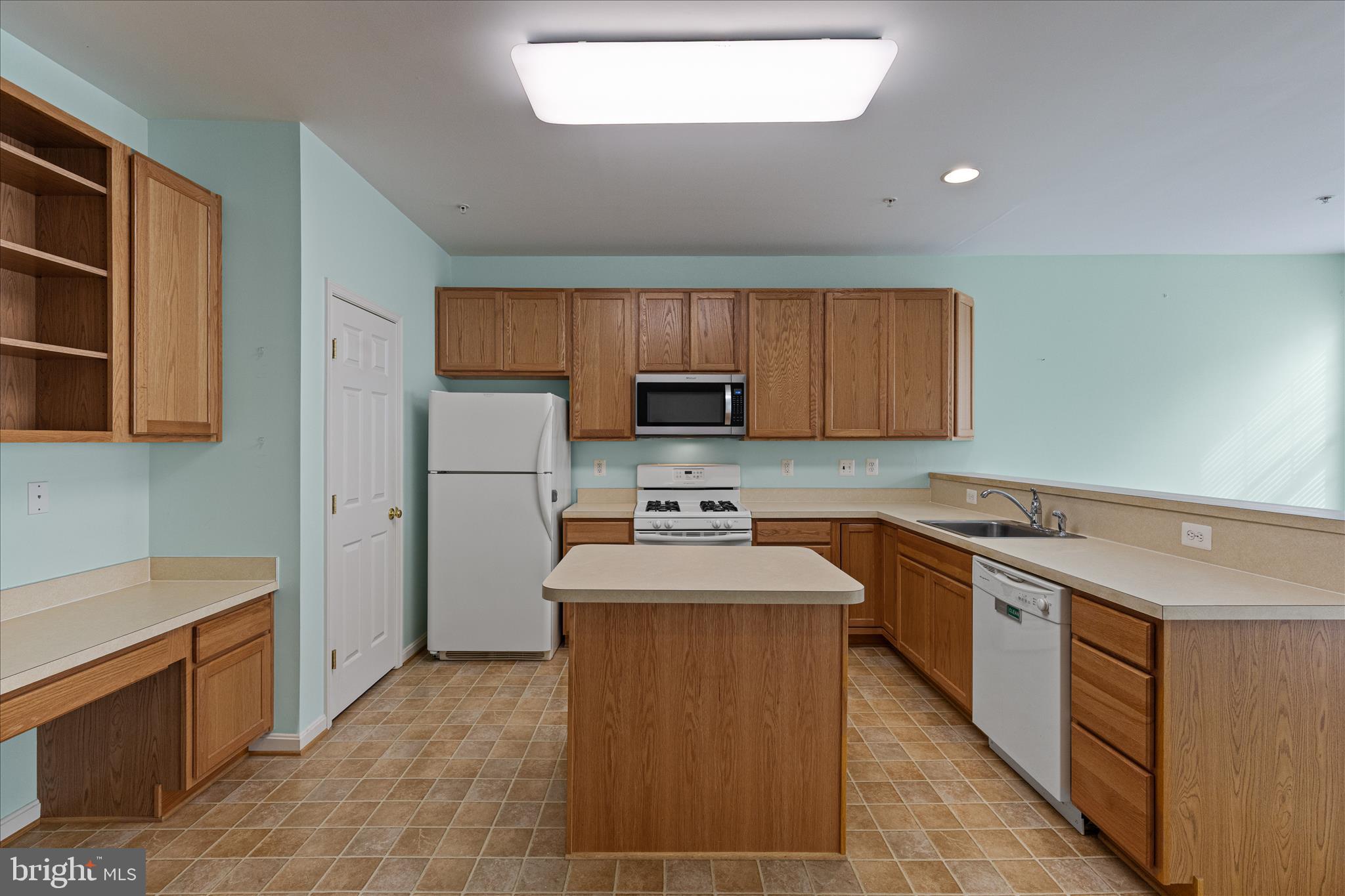 22742 Bayside Way California, MD 20619 - Photo 11 of 33 a kitchen with stainless steel appliances granite countertop a stove sink and cabinets