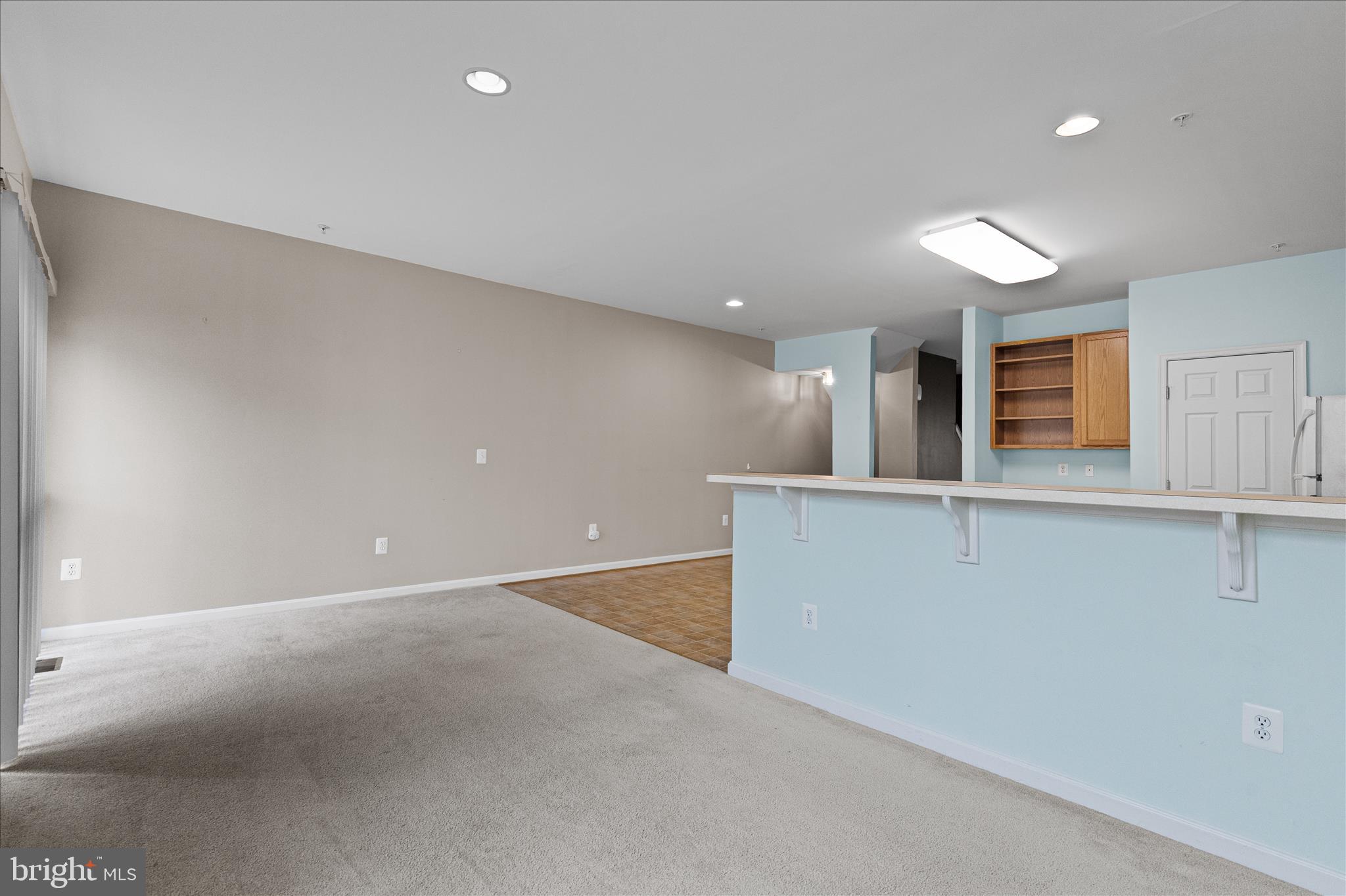 22742 Bayside Way California, MD 20619 - Photo 16 of 33 an empty room with wooden floor and windows