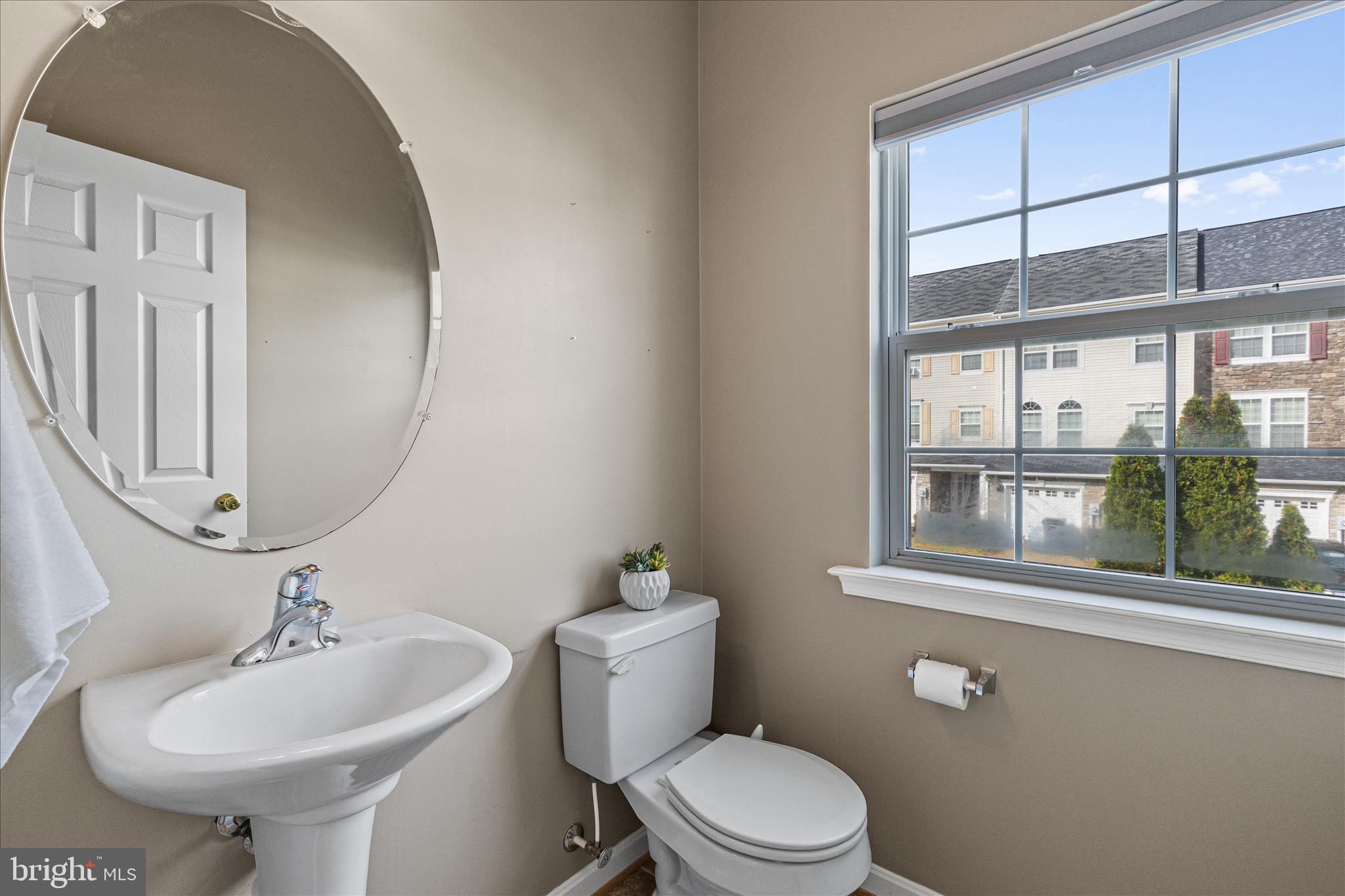 22742 Bayside Way California, MD 20619 - Photo 20 of 33 a bathroom with a sink a toilet and mirror