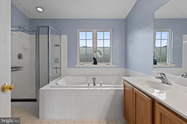 a bathroom with a bathtub and a sink