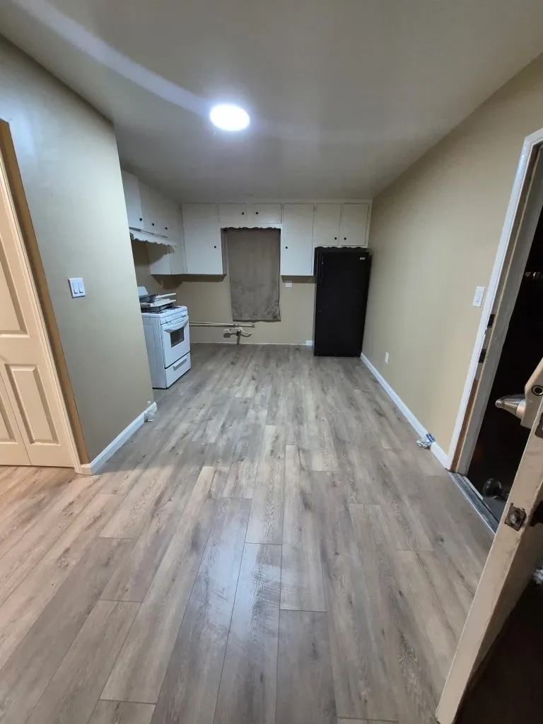 9330 Saffron Court Riverside, CA 92503 - Photo 2 of 21 9330 living room to kitchen with brand new floors
