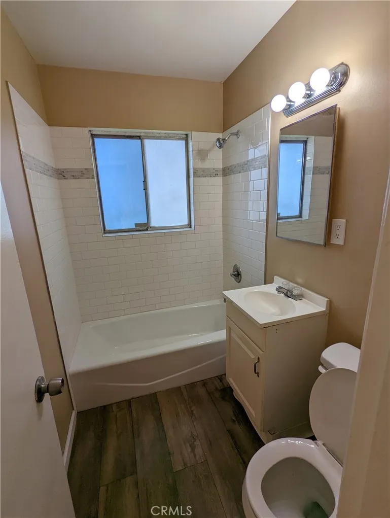 9330 Saffron Court Riverside, CA 92503 - Photo 8 of 21 a bathroom with a granite countertop toilet sink and mirror