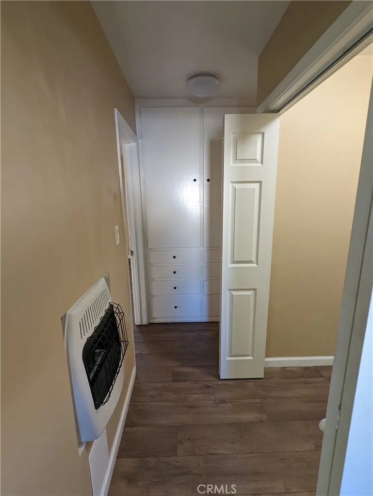 9330 Saffron Court Riverside, CA 92503 - Photo 9 of 21 a view of a livingroom with wooden floor and a washer dryer