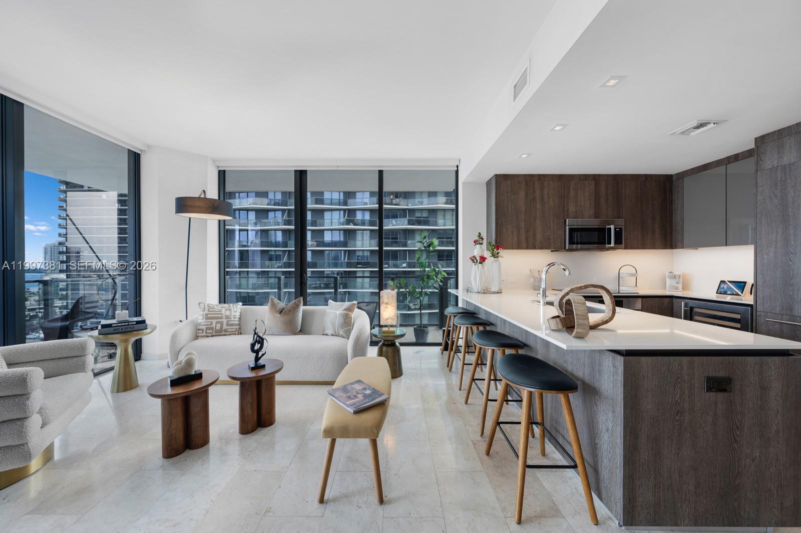 a kitchen with a table chairs stove and cabinets