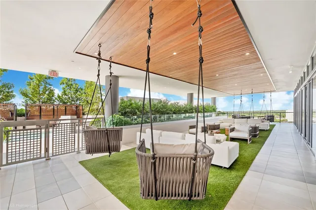 a patio with yard table and chairs