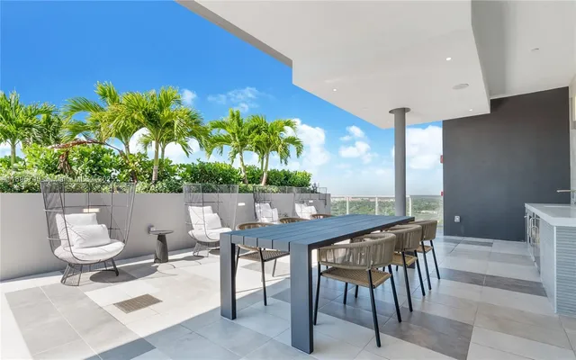a open kitchen with a sink dining table and chairs