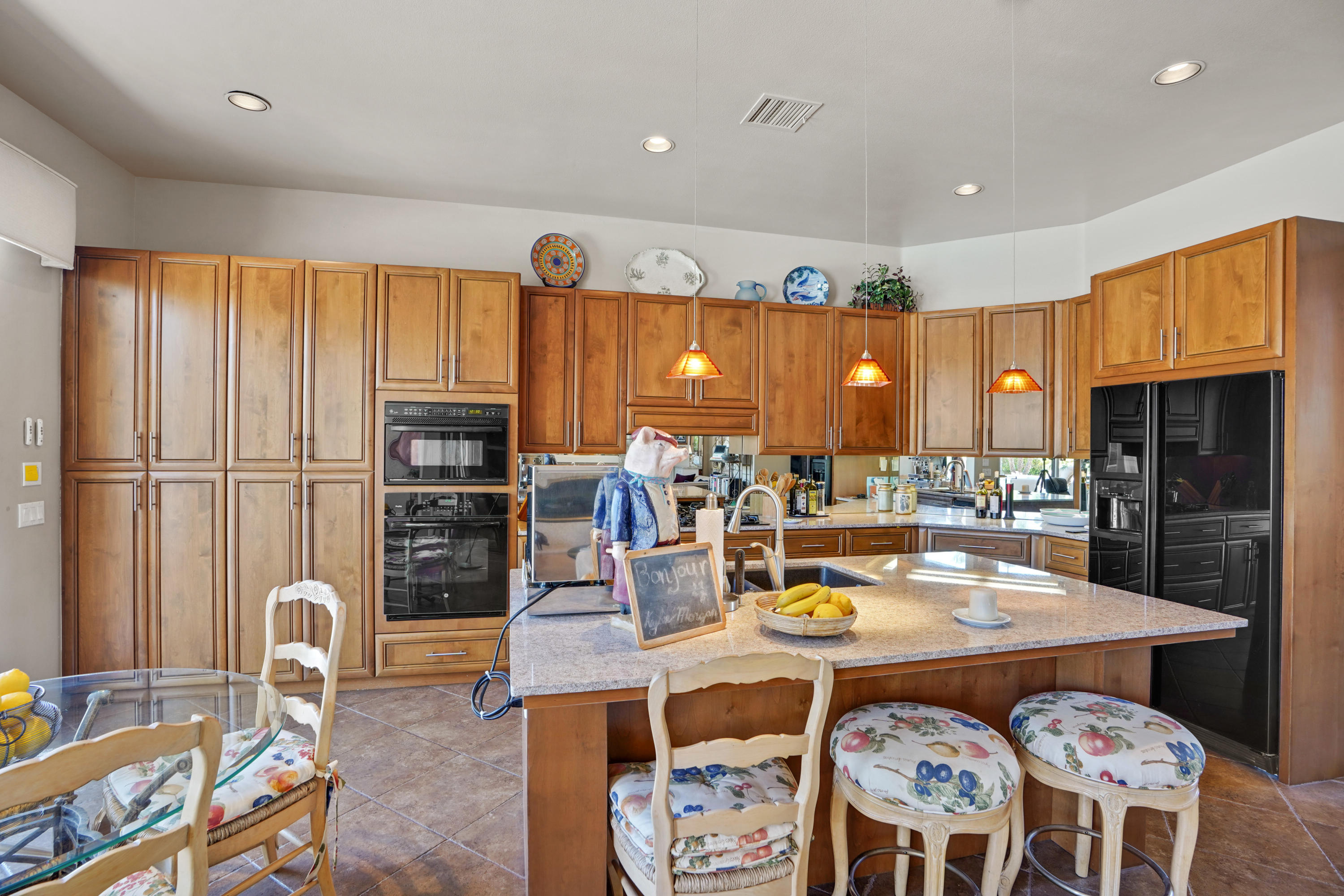 3 Silver Circle Rancho Mirage, CA 92270 - Photo 11 of 34 a dining room with furniture a window and a kitchen view
