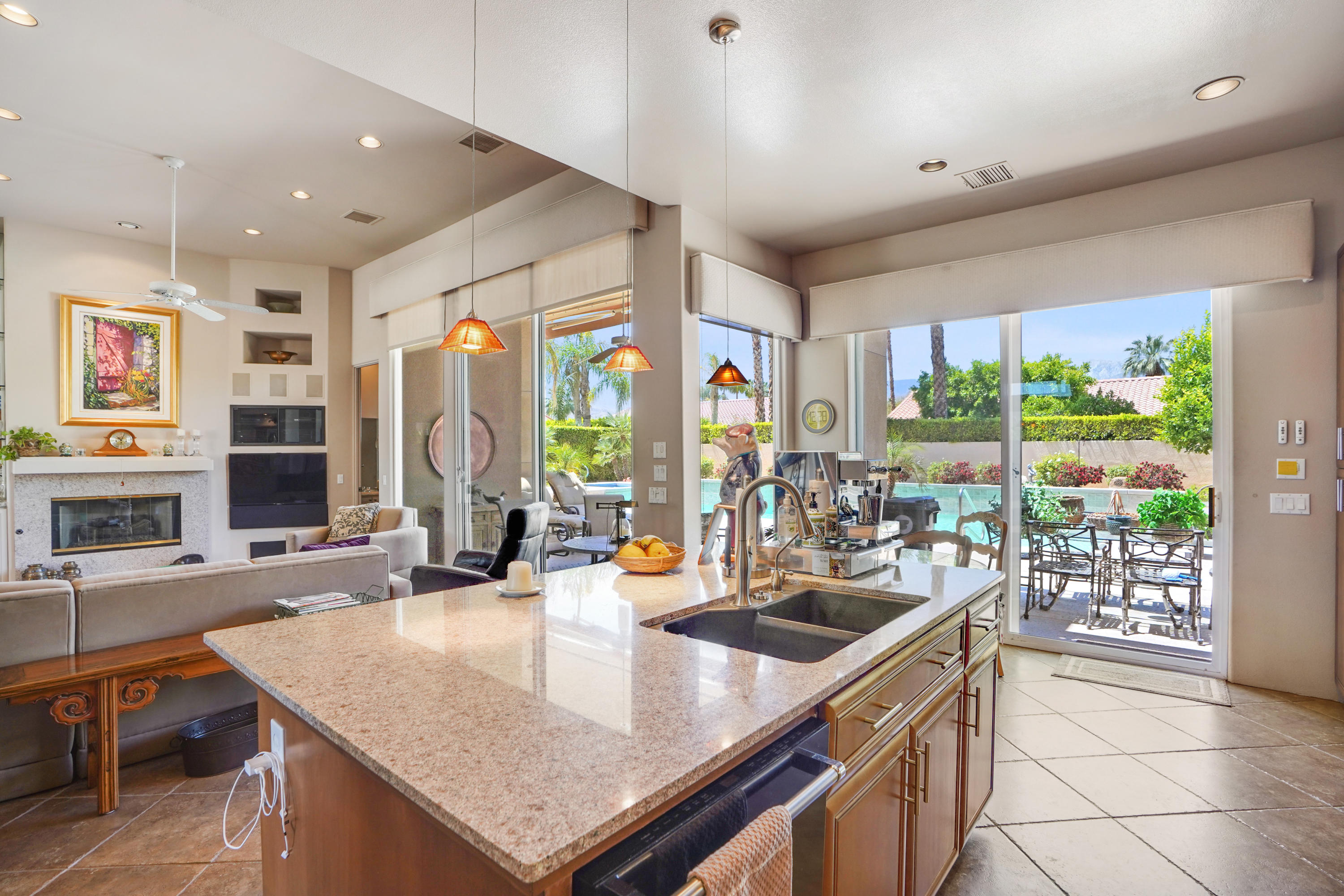 3 Silver Circle Rancho Mirage, CA 92270 - Photo 14 of 34 a room with stainless steel appliances granite countertop a sink a counter top space and living room view