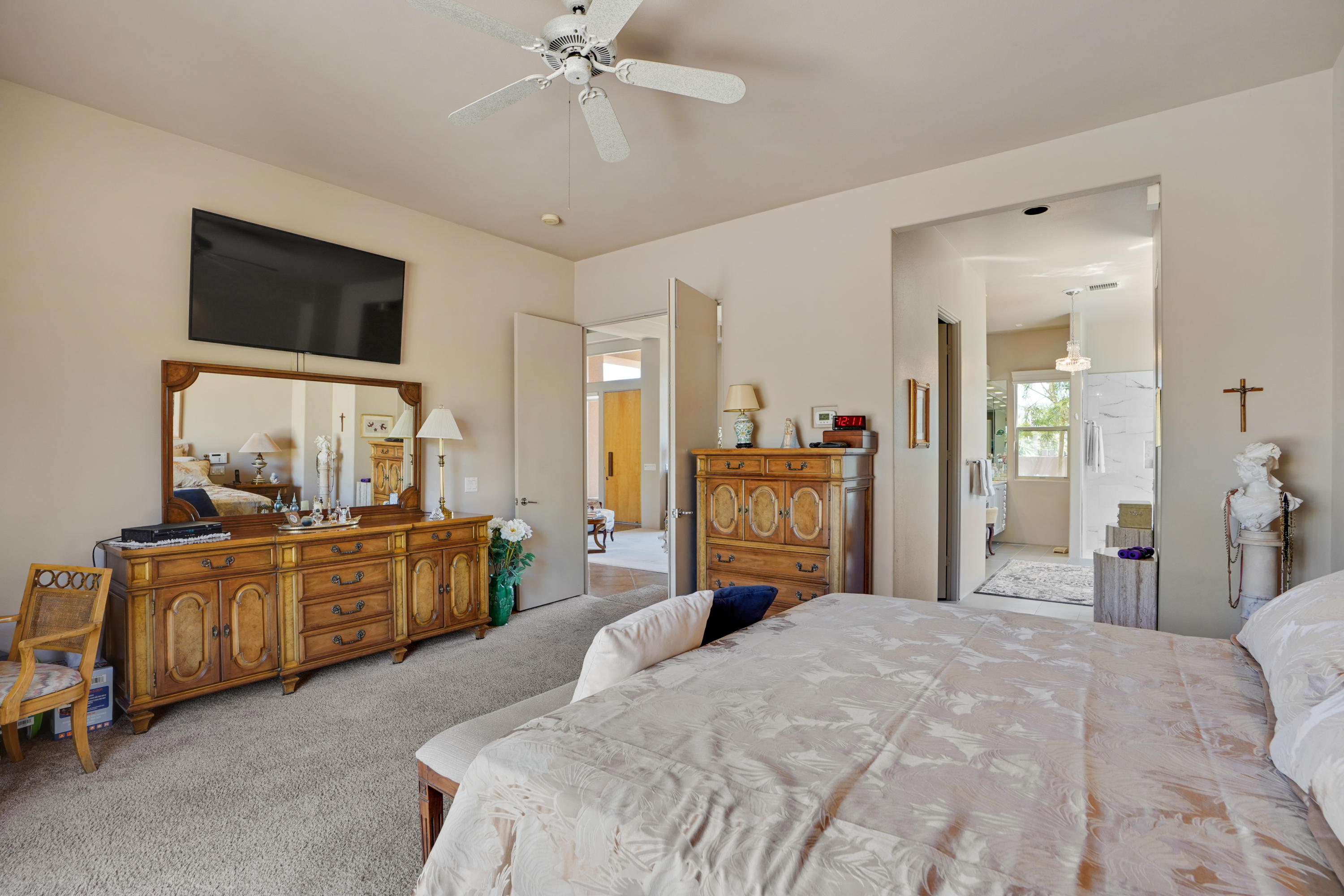 3 Silver Circle Rancho Mirage, CA 92270 - Photo 16 of 34 a bedroom with a bed flat screen tv and dresser