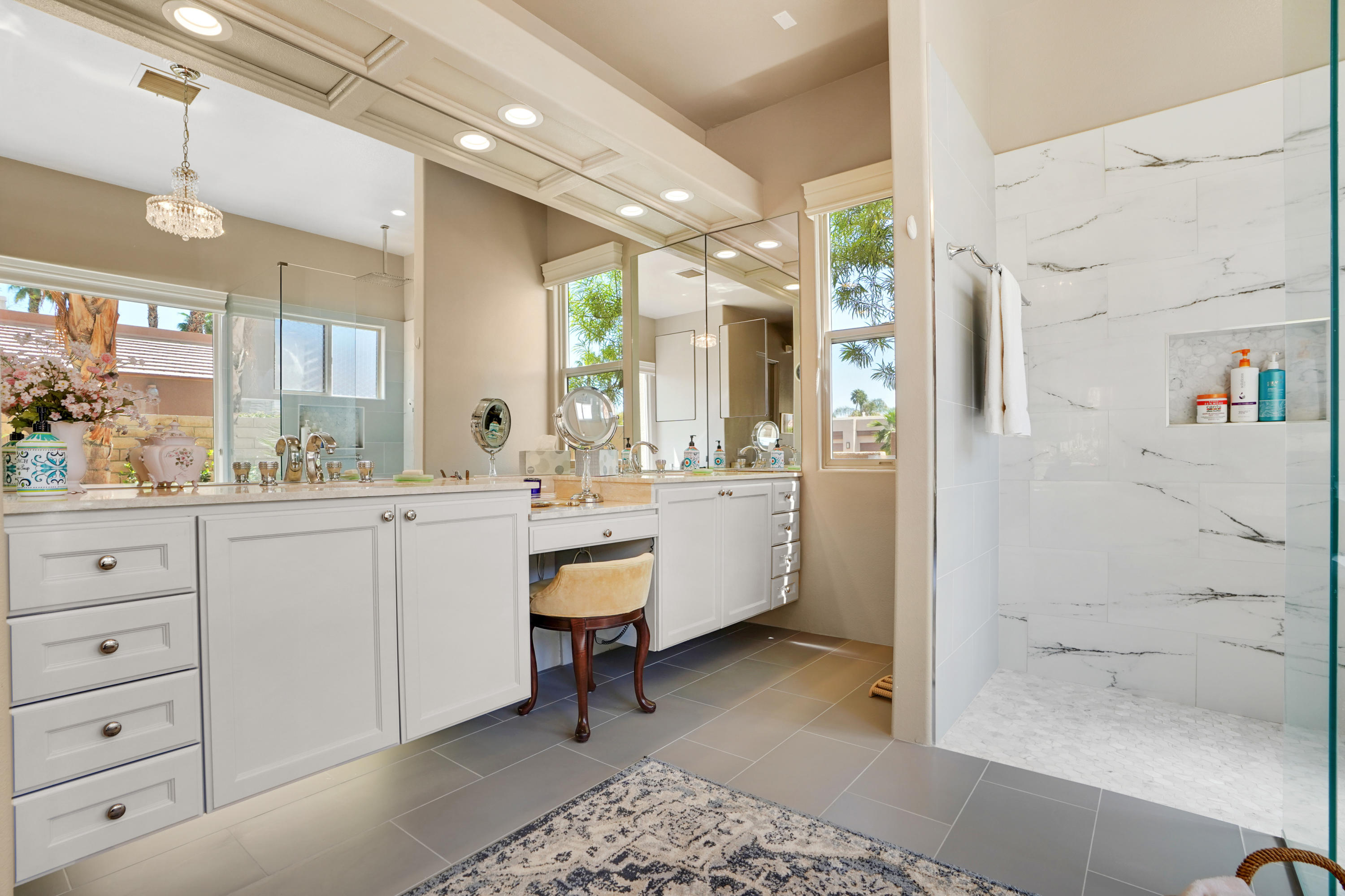 3 Silver Circle Rancho Mirage, CA 92270 - Photo 17 of 34 a bathroom with a sink mirror and a shower