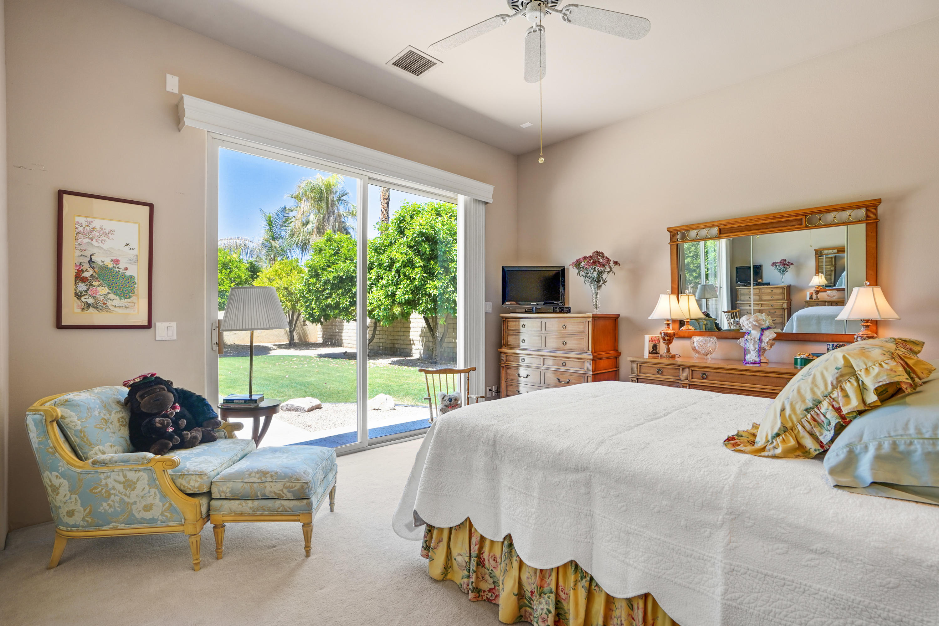 3 Silver Circle Rancho Mirage, CA 92270 - Photo 19 of 34 a bed room with a bed and a couch