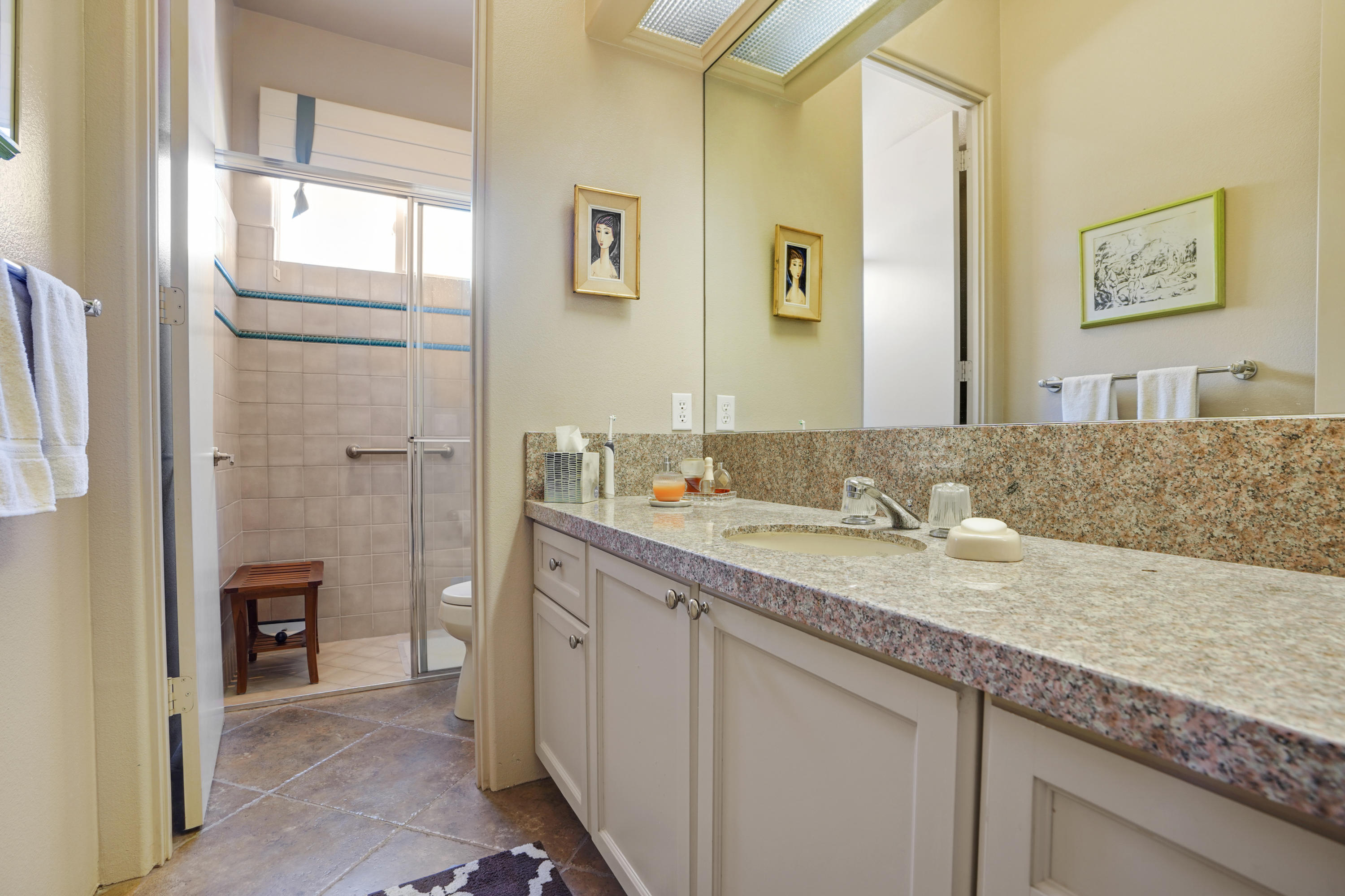 3 Silver Circle Rancho Mirage, CA 92270 - Photo 20 of 34 a bathroom with a granite countertop sink mirror and double