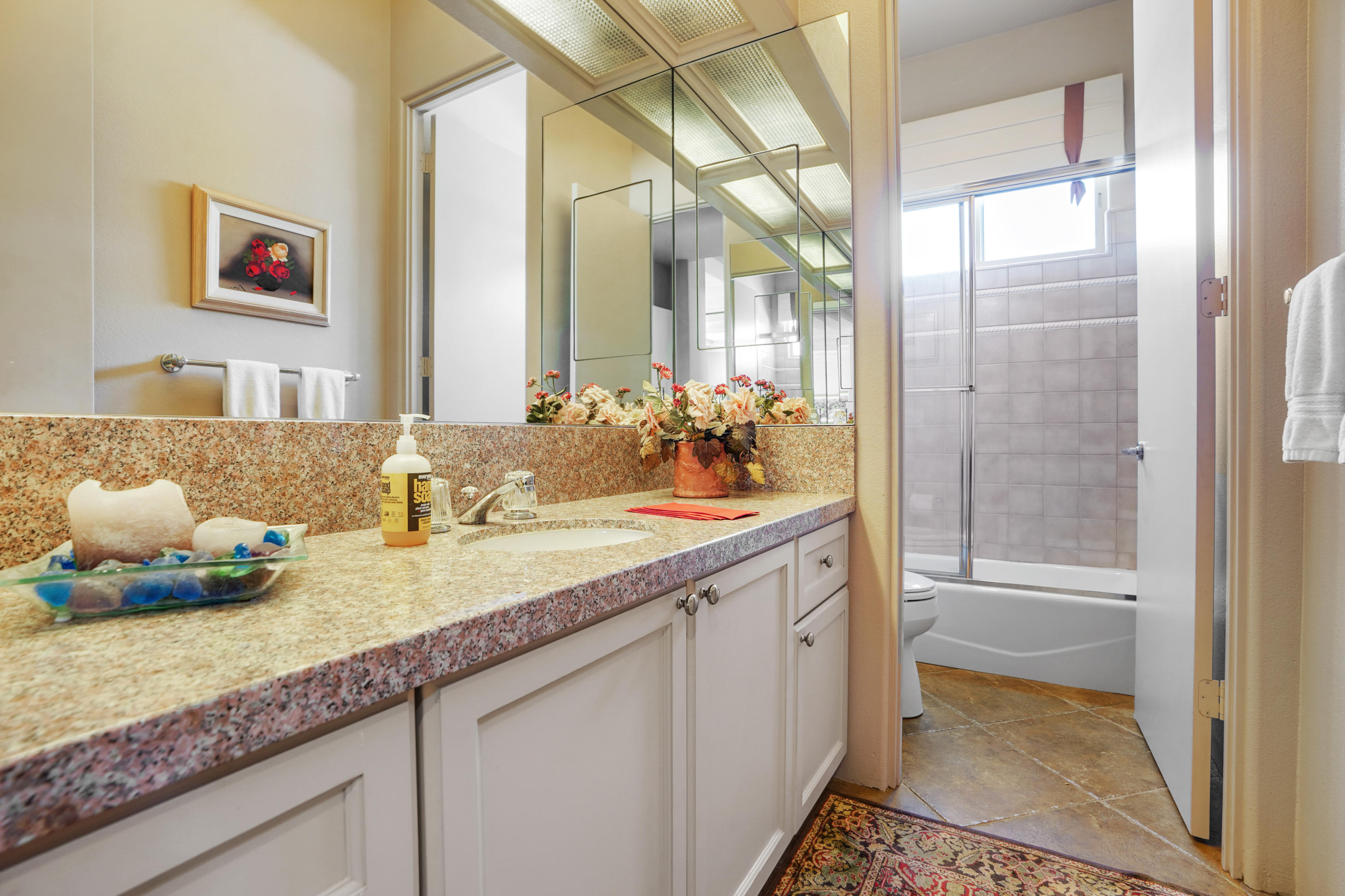 3 Silver Circle Rancho Mirage, CA 92270 - Photo 22 of 34 a bathroom with a granite countertop sink and a mirror