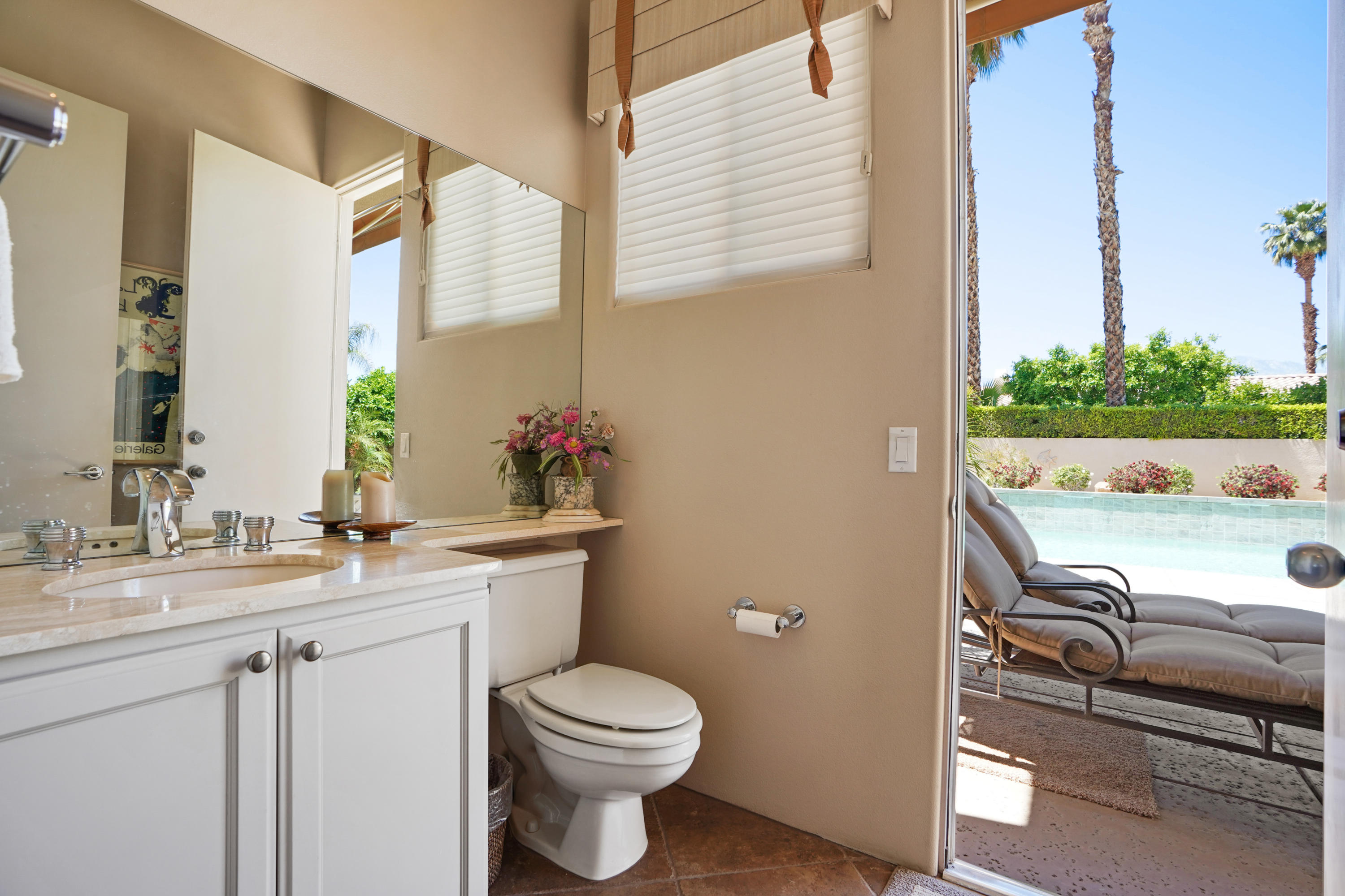 3 Silver Circle Rancho Mirage, CA 92270 - Photo 23 of 34 a bathroom with a toilet sink and mirror