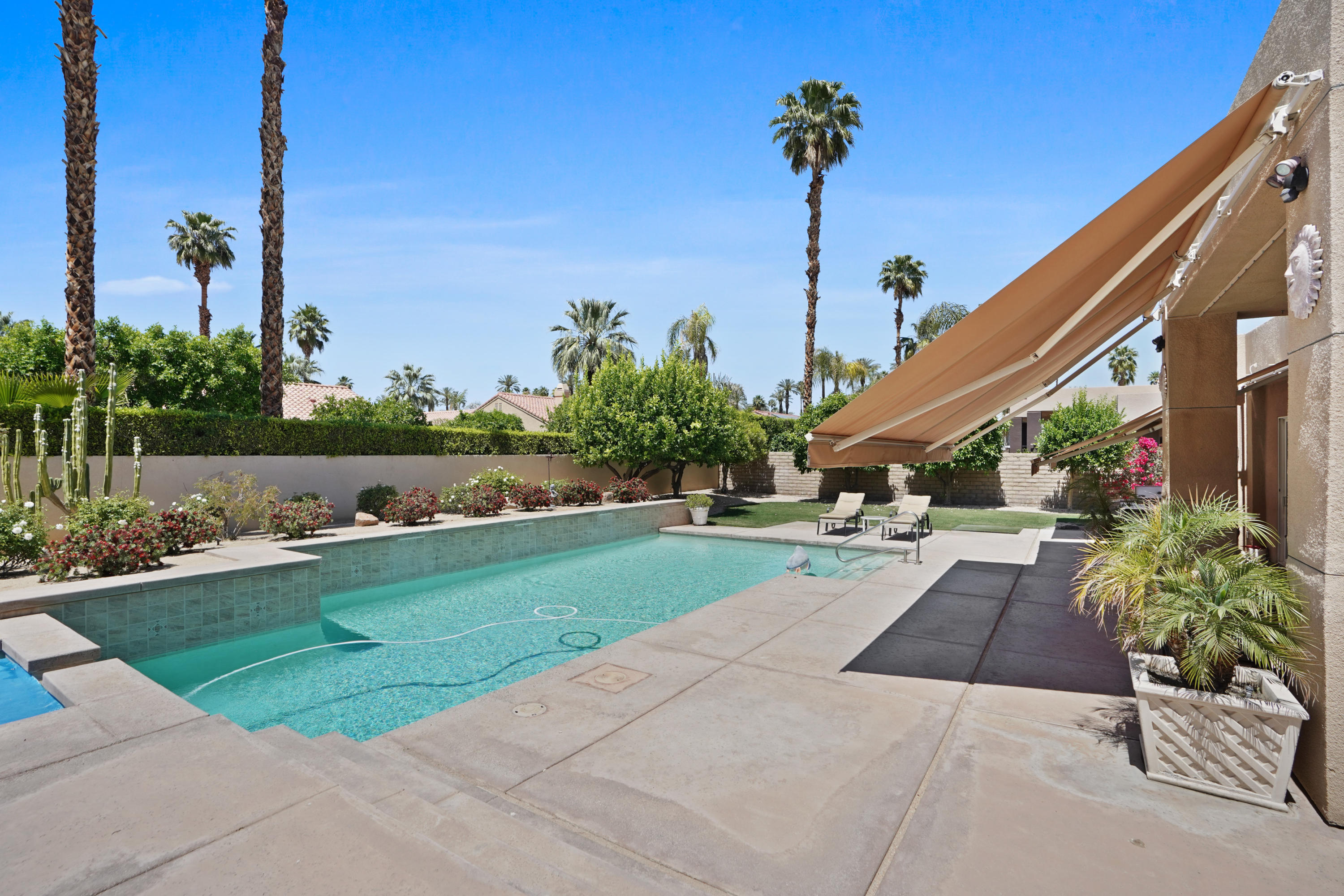 3 Silver Circle Rancho Mirage, CA 92270 - Photo 28 of 34 a view of a patio with a table and chairs potted plants