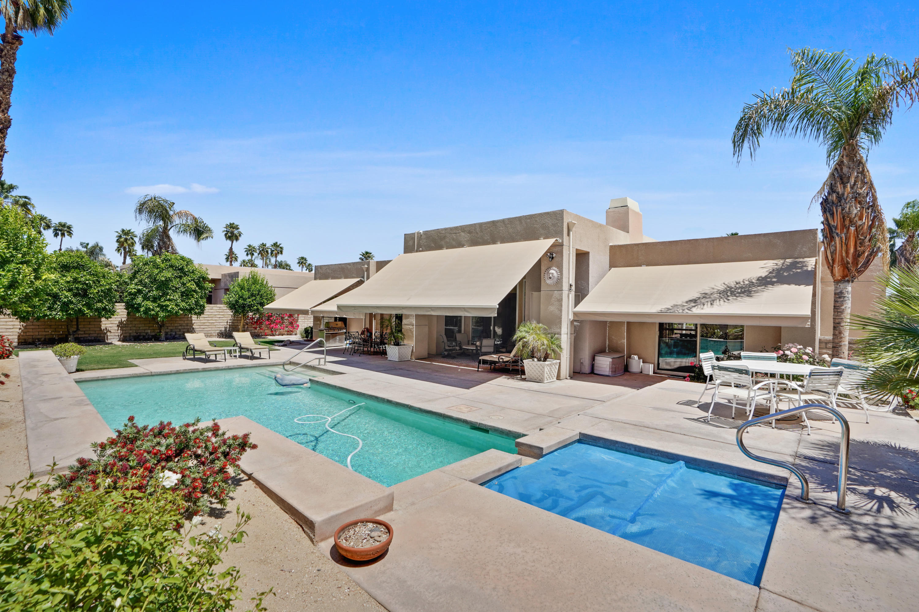 3 Silver Circle Rancho Mirage, CA 92270 - Photo 29 of 34 a view of a house with swimming pool and sitting area