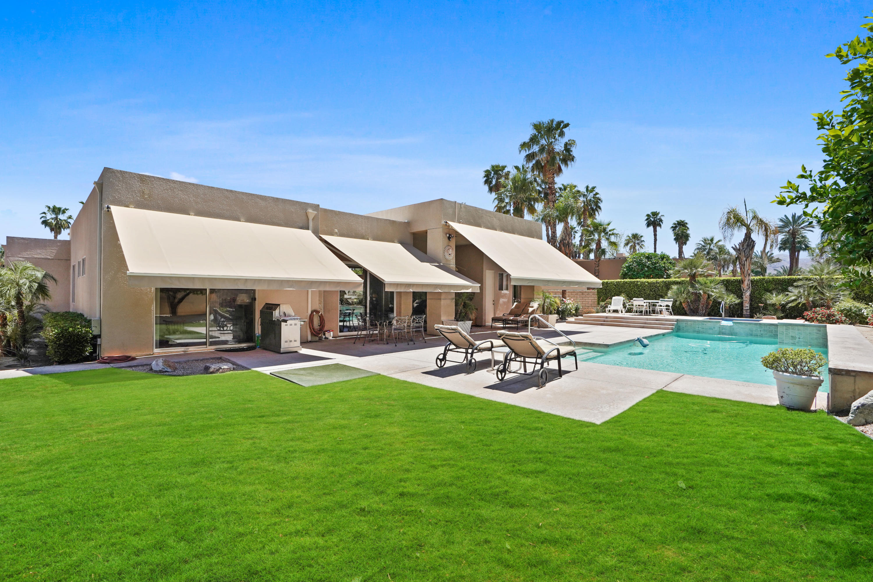 3 Silver Circle Rancho Mirage, CA 92270 - Photo 30 of 34 a view of a house with backyard porch and sitting area