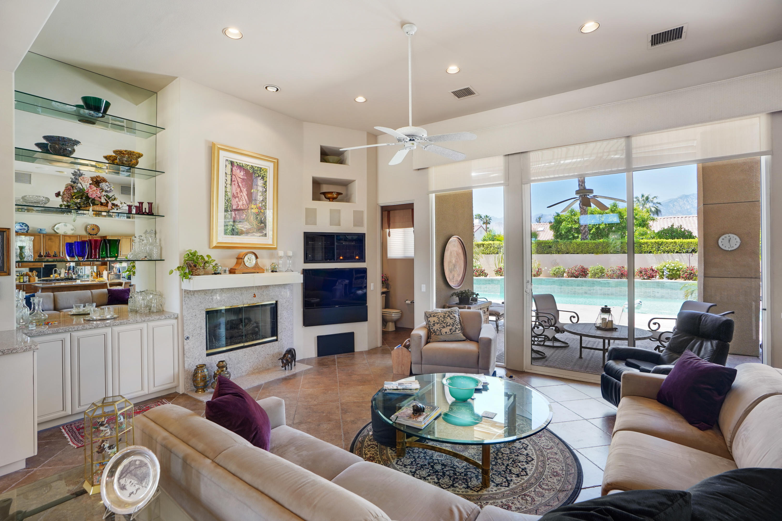 3 Silver Circle Rancho Mirage, CA 92270 - Photo 6 of 34 a living room with furniture fireplace and a large window