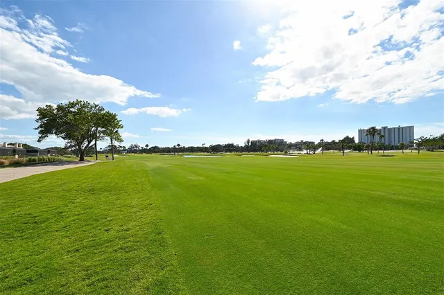 a view of a swimming pool with an outdoor seating