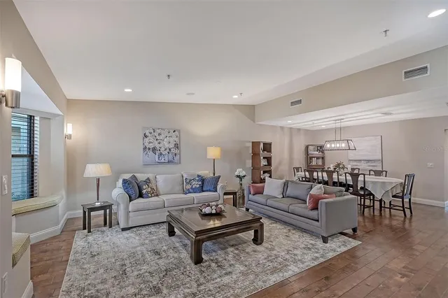 a living room with furniture and a table