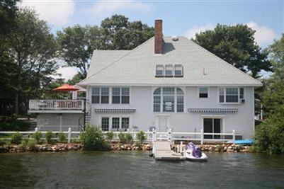 429 Lakeside Drive West Centerville, MA 02632 - Photo 1 of 21 a front view of a house with sitting area