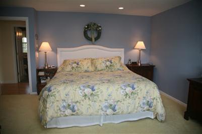 429 Lakeside Drive West Centerville, MA 02632 - Photo 12 of 21 a large bed sitting in a bedroom next to a lamp