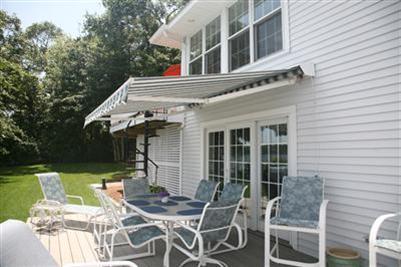 429 Lakeside Drive West Centerville, MA 02632 - Photo 19 of 21 a view of a patio with table and chairs and potted plants