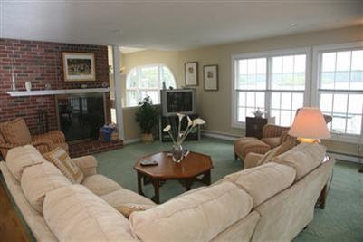 429 Lakeside Drive West Centerville, MA 02632 - Photo 5 of 21 a living room with furniture and a fireplace