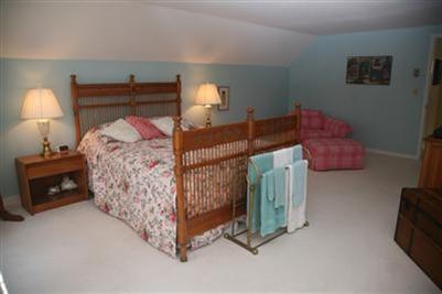 429 Lakeside Drive West Centerville, MA 02632 - Photo 10 of 21 a bedroom with bed and a lamp on dresser