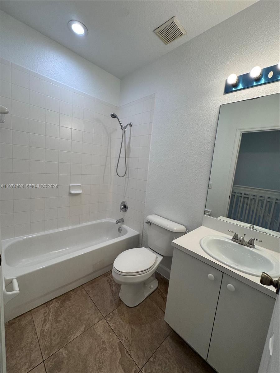 8500 Southwest 150th Avenue, Unit 3 Miami, FL 33193 - Photo 15 of 22 a bathroom with a sink a toilet and shower
