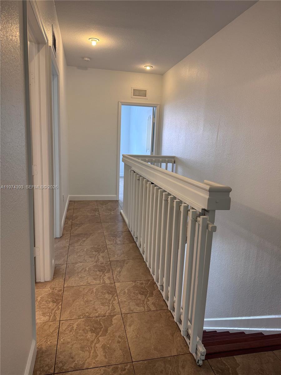 8500 Southwest 150th Avenue, Unit 3 Miami, FL 33193 - Photo 18 of 22 a view of a hallway with entryway