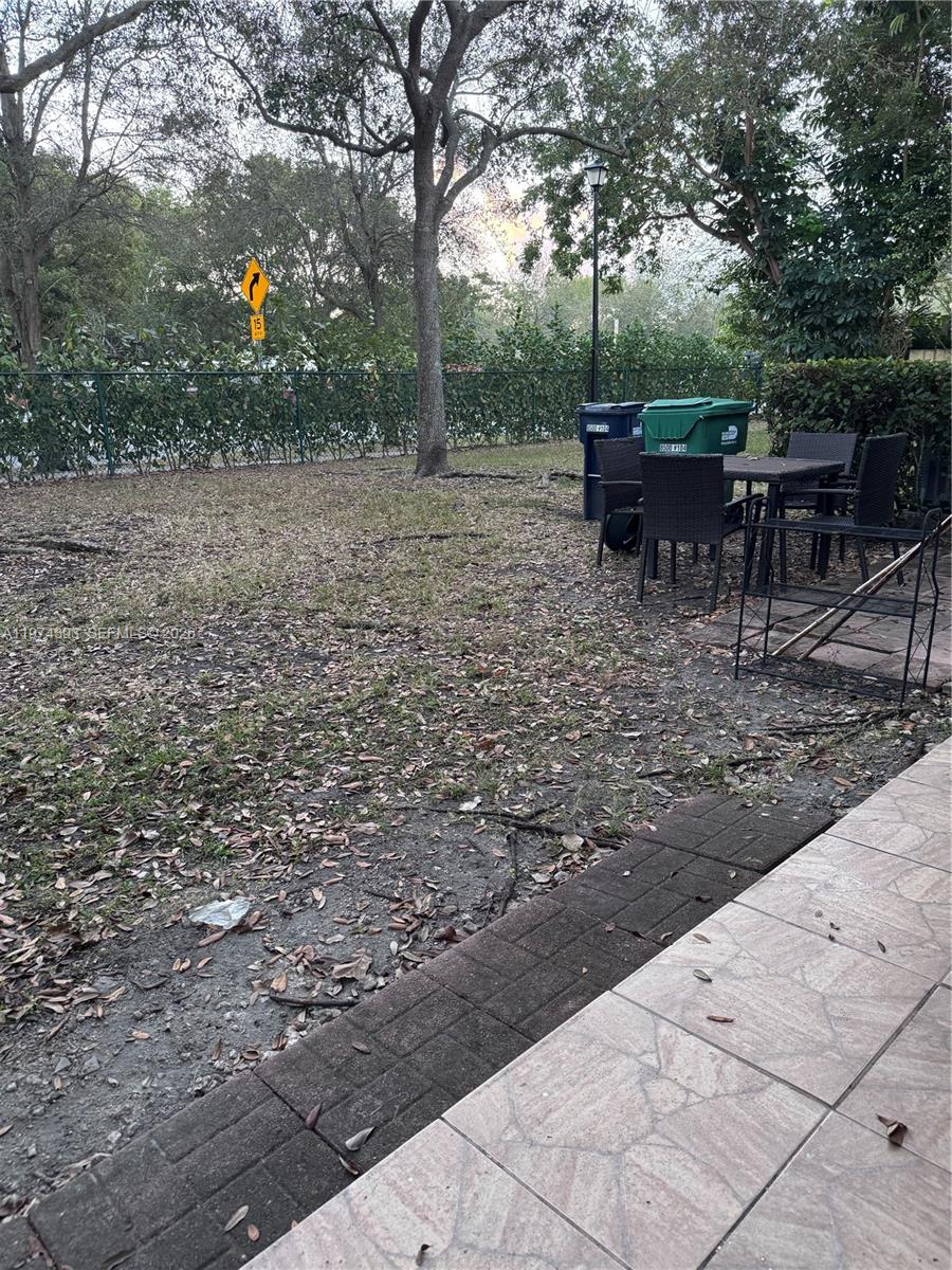 8500 Southwest 150th Avenue, Unit 3 Miami, FL 33193 - Photo 20 of 22 a view of a backyard with sitting area