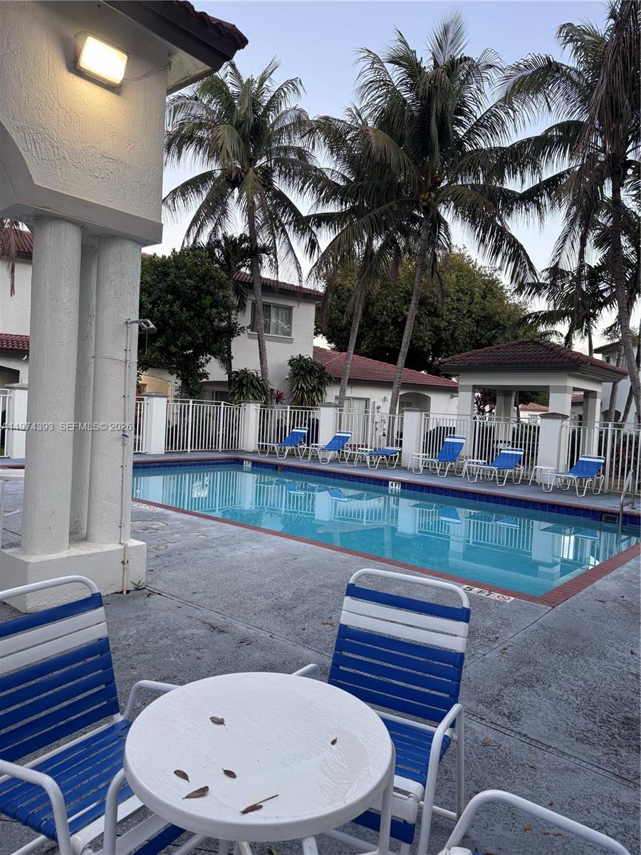8500 Southwest 150th Avenue, Unit 3 Miami, FL 33193 - Photo 21 of 22 a view of house with roof deck and outdoor seating
