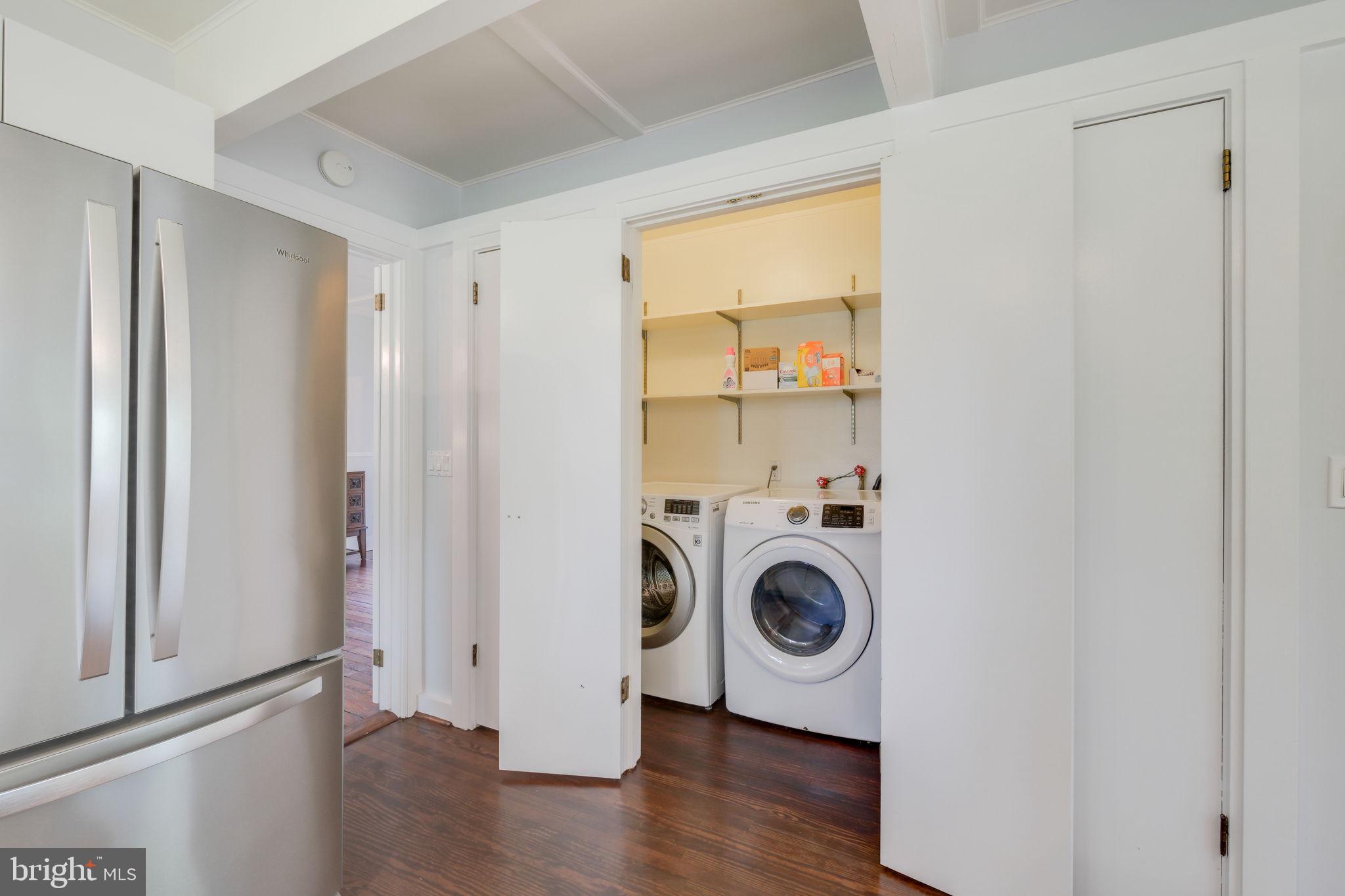 6220 Mazwood Road Rockville, MD 20852 - Photo 15 of 47 a view of walk in closet with wooden floor and window