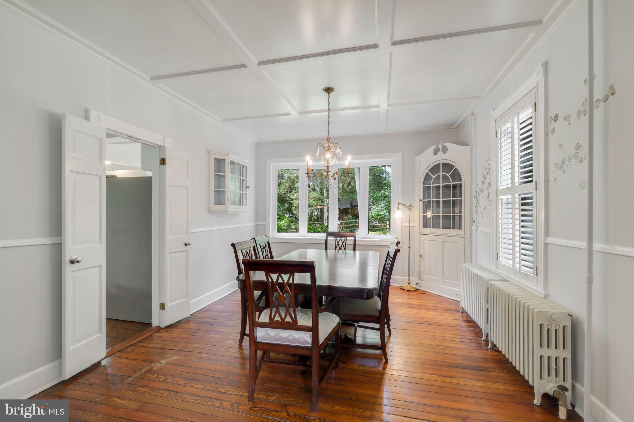 6220 Mazwood Road Rockville, MD 20852 - Photo 16 of 47 a view of a dining room with furniture window and wooden floor