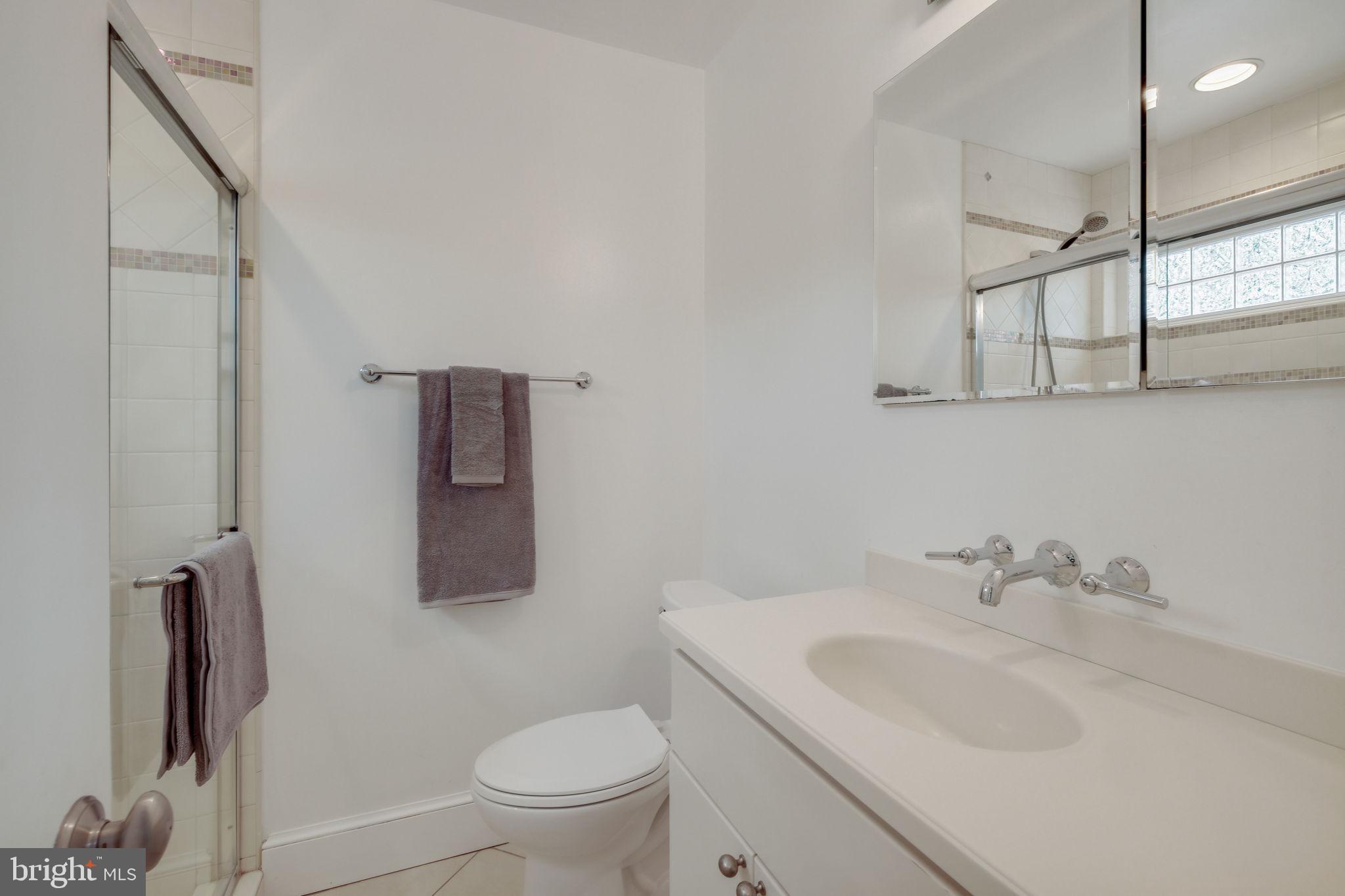 6220 Mazwood Road Rockville, MD 20852 - Photo 24 of 47 a bathroom with a sink toilet and vanity