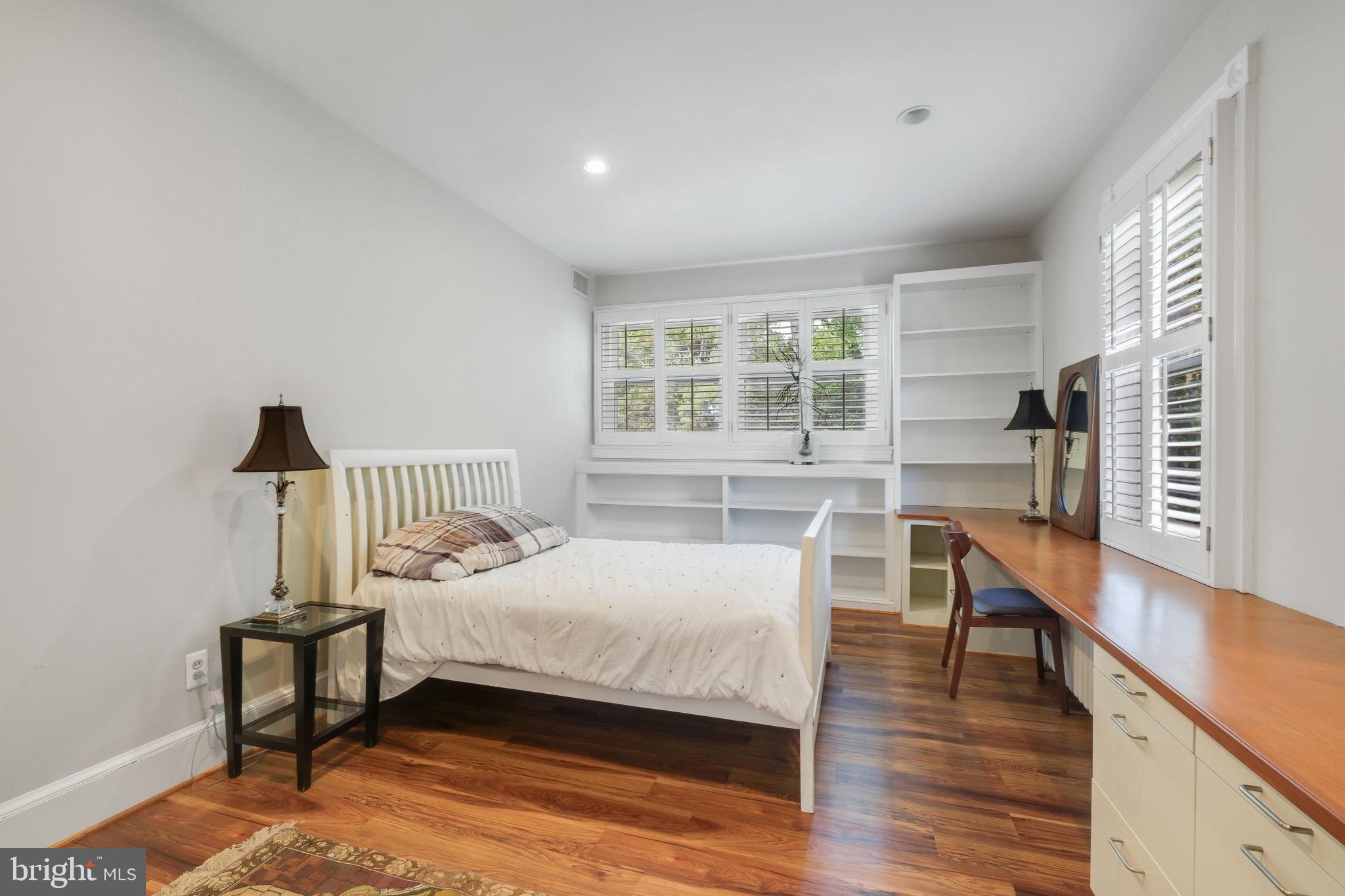 6220 Mazwood Road Rockville, MD 20852 - Photo 25 of 47 a bedroom with furniture and a wooden floor