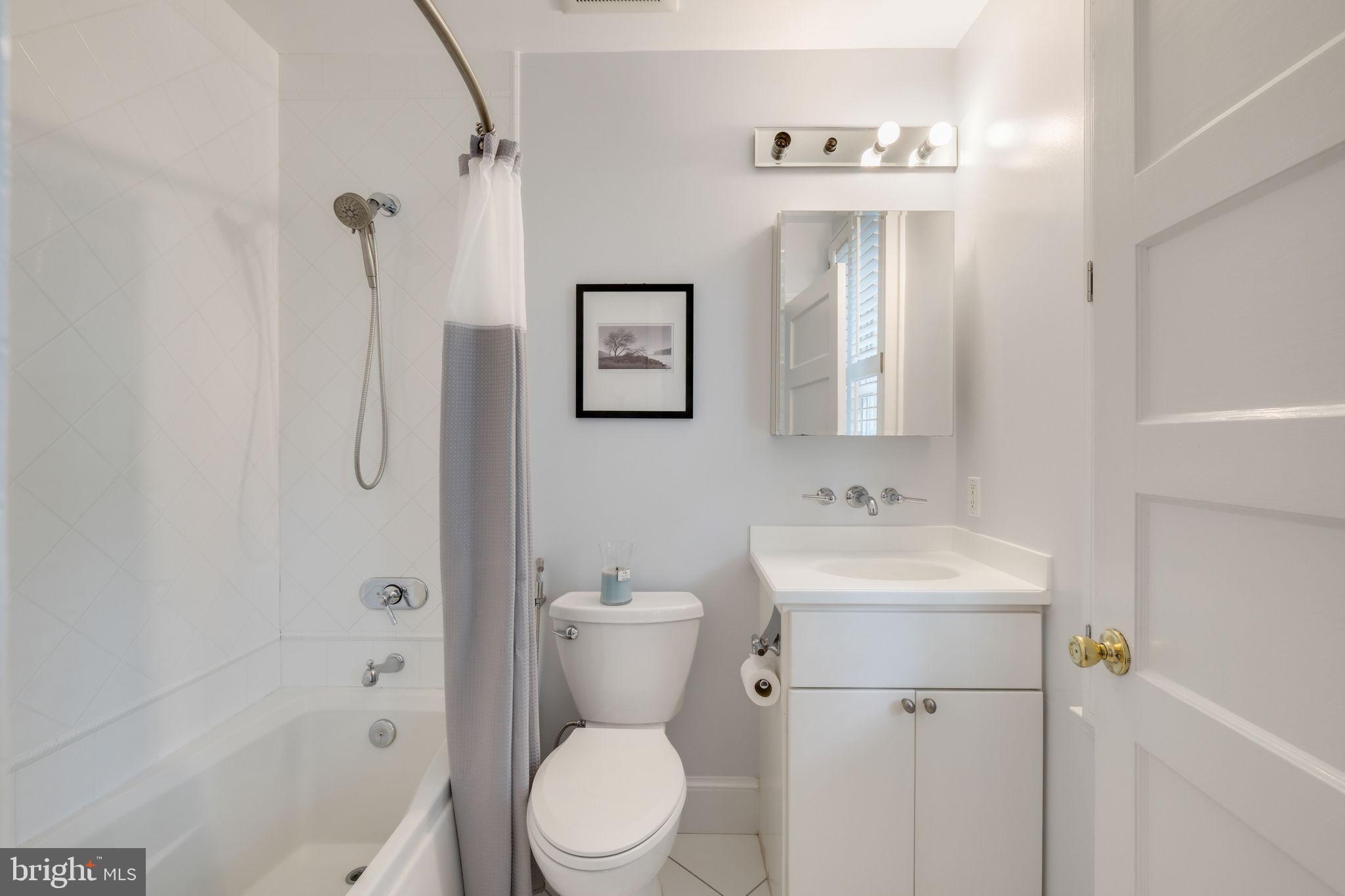 6220 Mazwood Road Rockville, MD 20852 - Photo 26 of 47 a bathroom with a toilet sink and shower