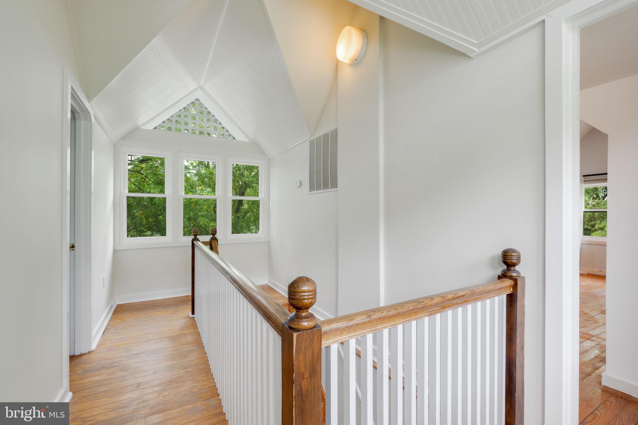 6220 Mazwood Road Rockville, MD 20852 - Photo 27 of 47 a view of a hallway with windows