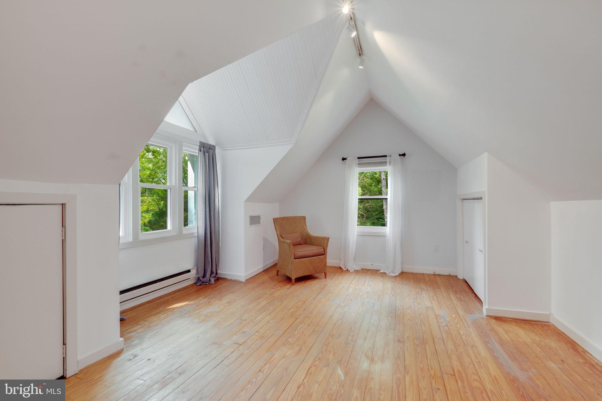 6220 Mazwood Road Rockville, MD 20852 - Photo 29 of 47 a view of an empty room with a window and wooden floor