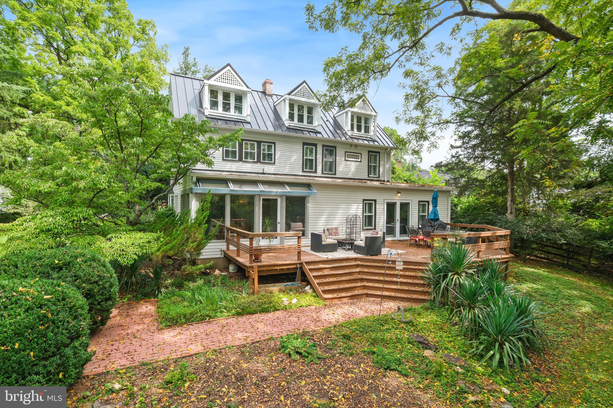 6220 Mazwood Road Rockville, MD 20852 - Photo 37 of 47 a front view of a house with garden and porch