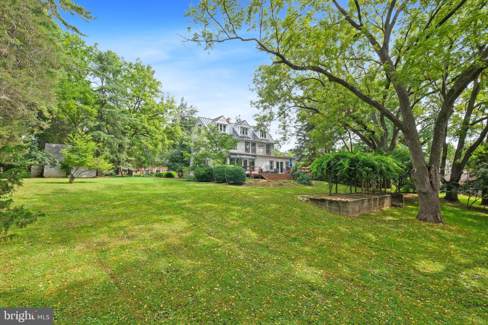 6220 Mazwood Road Rockville, MD 20852 - Photo 38 of 47 a view of a house with a yard