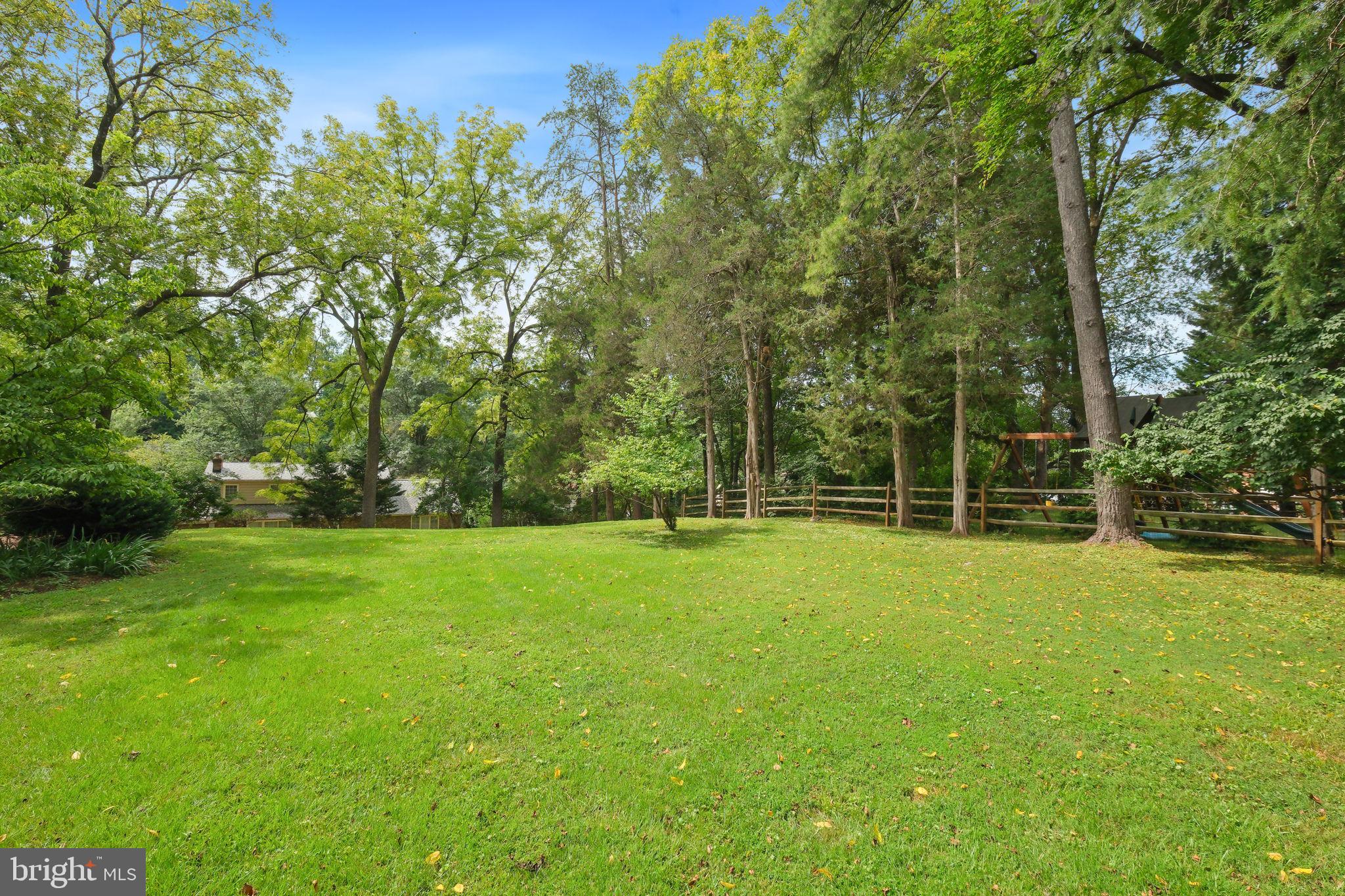 6220 Mazwood Road Rockville, MD 20852 - Photo 39 of 47 a view of a field with trees in the background
