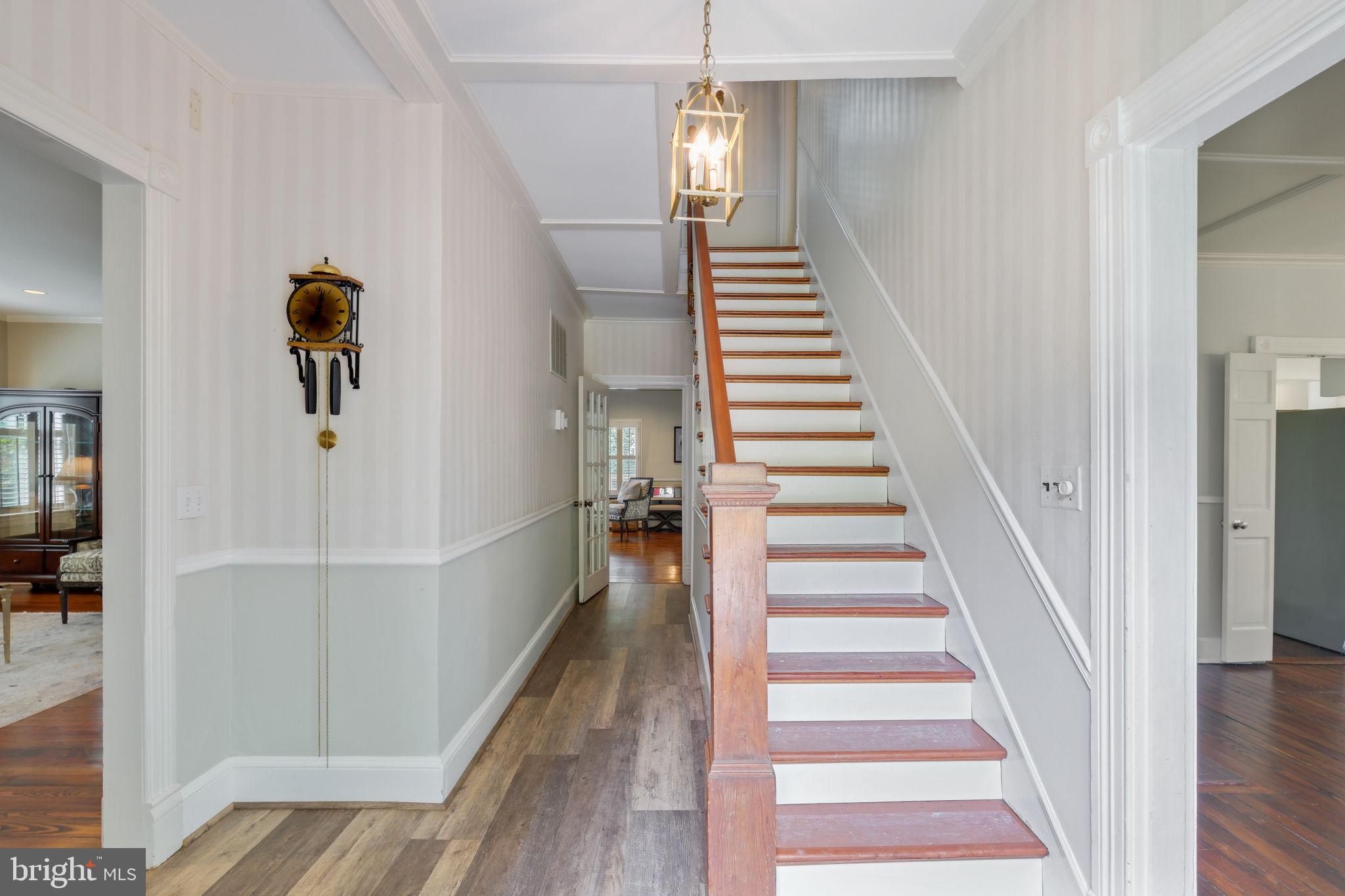 6220 Mazwood Road Rockville, MD 20852 - Photo 5 of 47 a view of a hallway with wooden floor and entryway