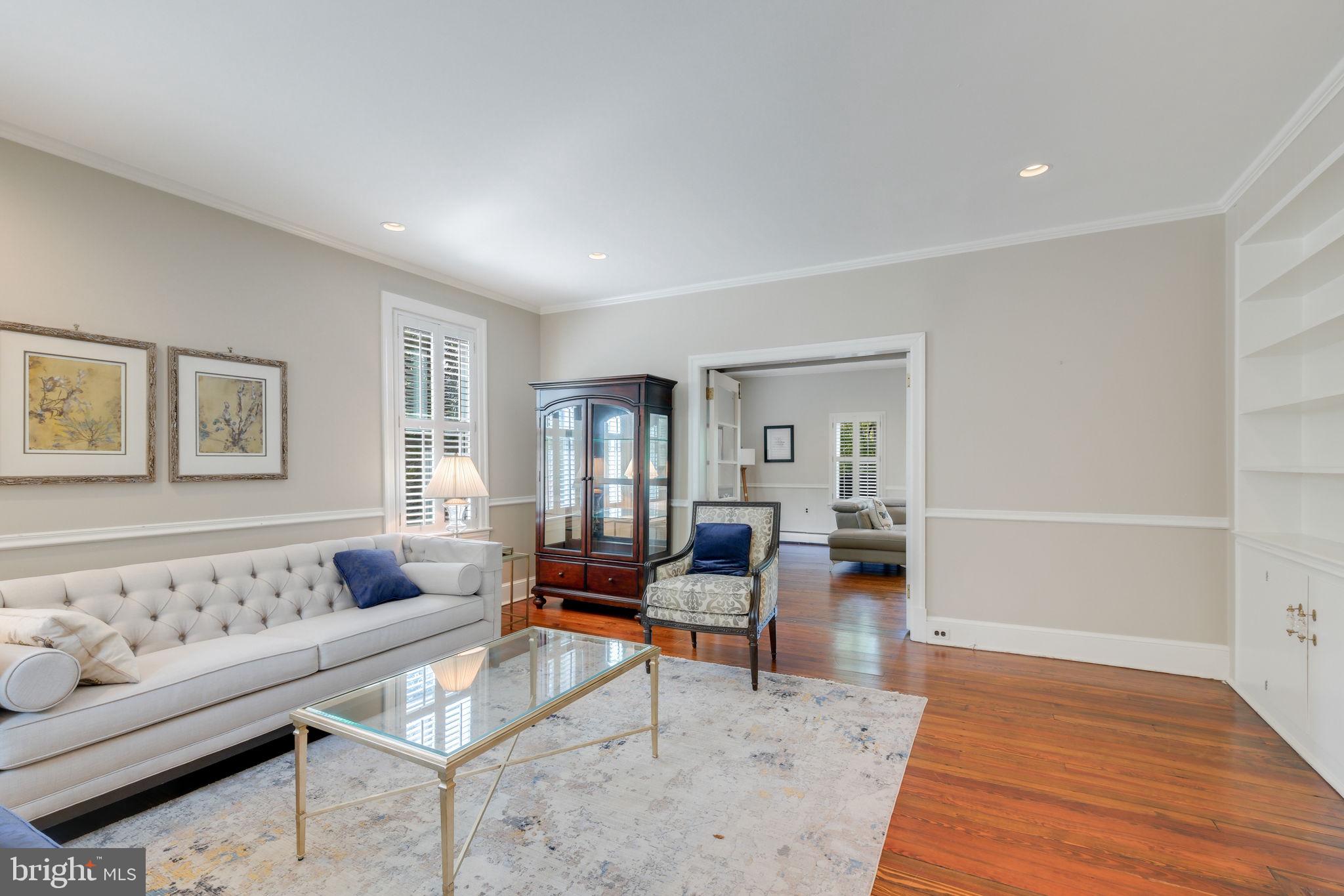 6220 Mazwood Road Rockville, MD 20852 - Photo 6 of 47 a living room with furniture and a wooden floor